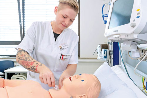 A nursing student during training with her training group.